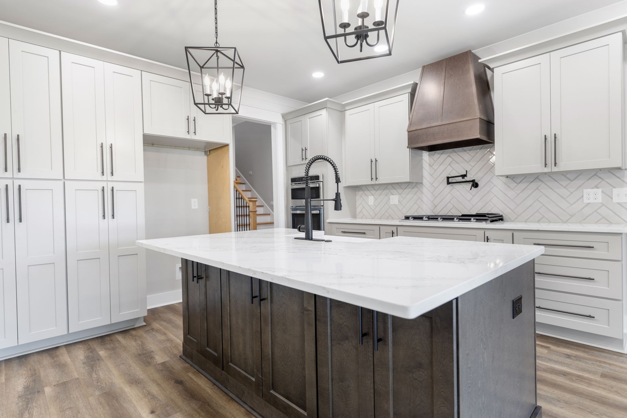 887 Ovoca Lake Road Tullahoma, TN 37388 - Photo 18 of 58 a kitchen with kitchen island granite countertop a sink cabinets a stove and a refrigerator