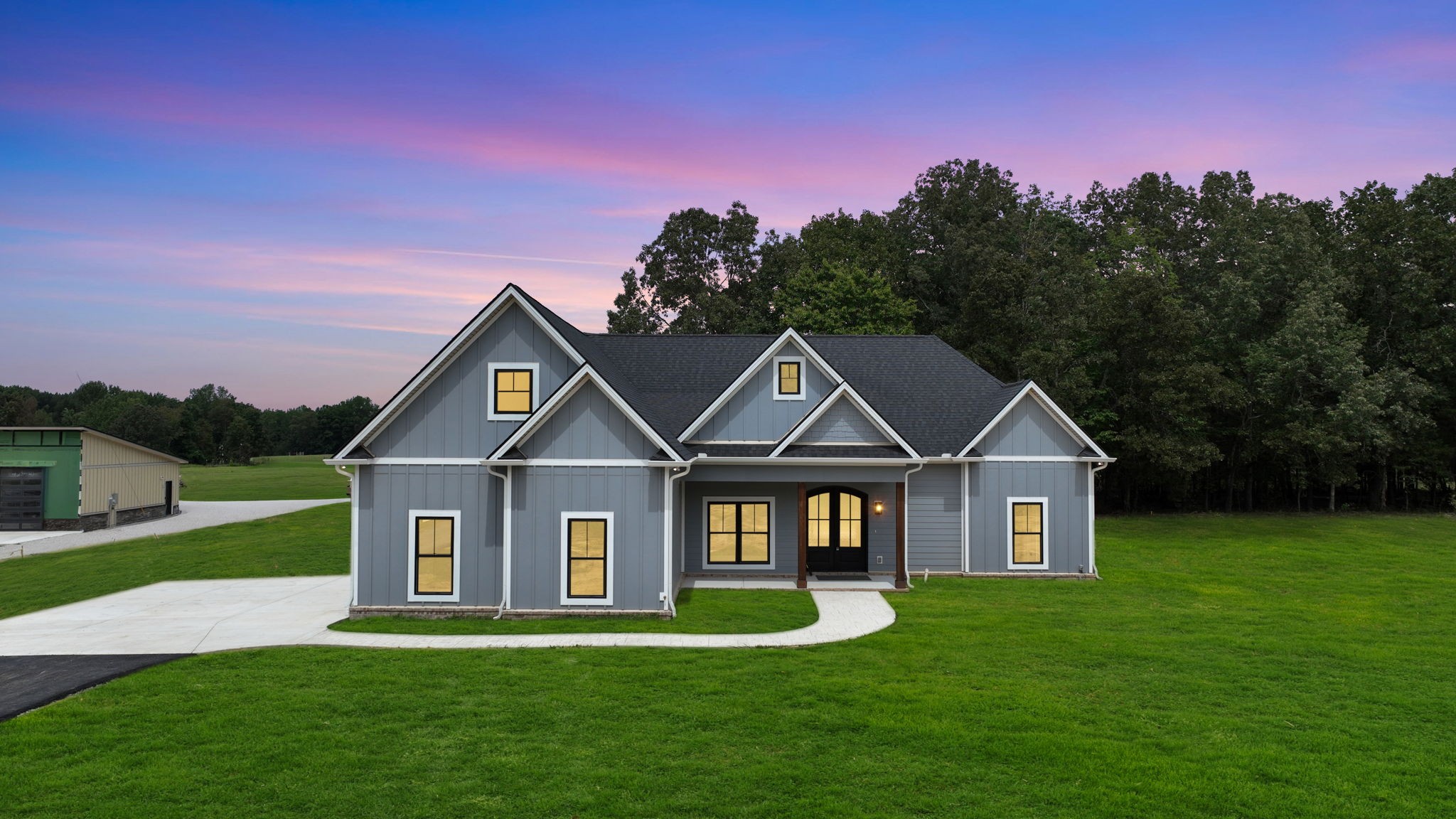 887 Ovoca Lake Road Tullahoma, TN 37388 - Photo 2 of 58 a front view of a house with a yard