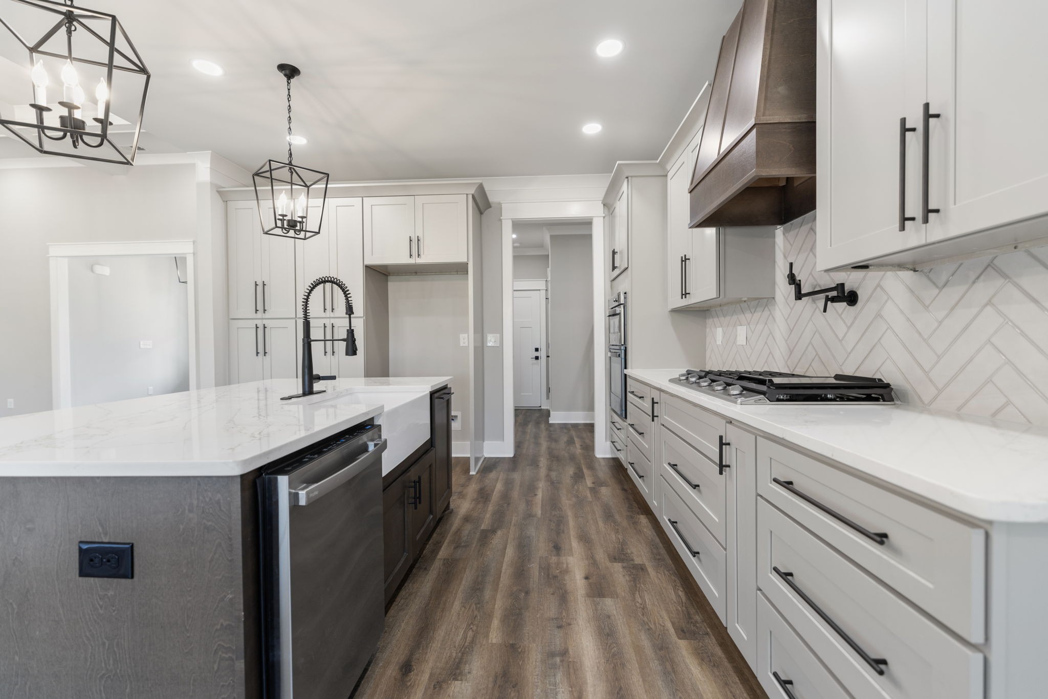887 Ovoca Lake Road Tullahoma, TN 37388 - Photo 21 of 58 a large kitchen with stainless steel appliances granite countertop a lot of counter space and wooden floors
