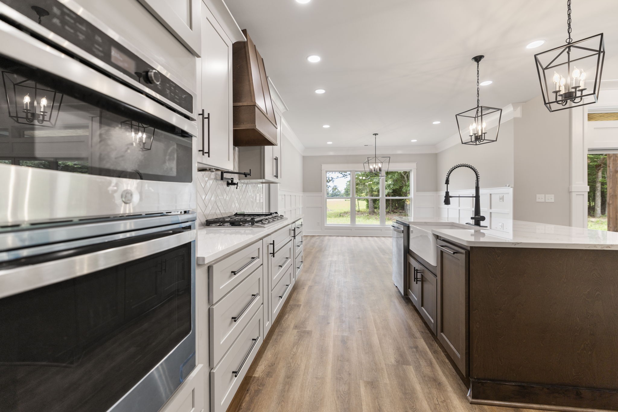 887 Ovoca Lake Road Tullahoma, TN 37388 - Photo 23 of 58 a large kitchen with stainless steel appliances granite countertop a stove and a sink