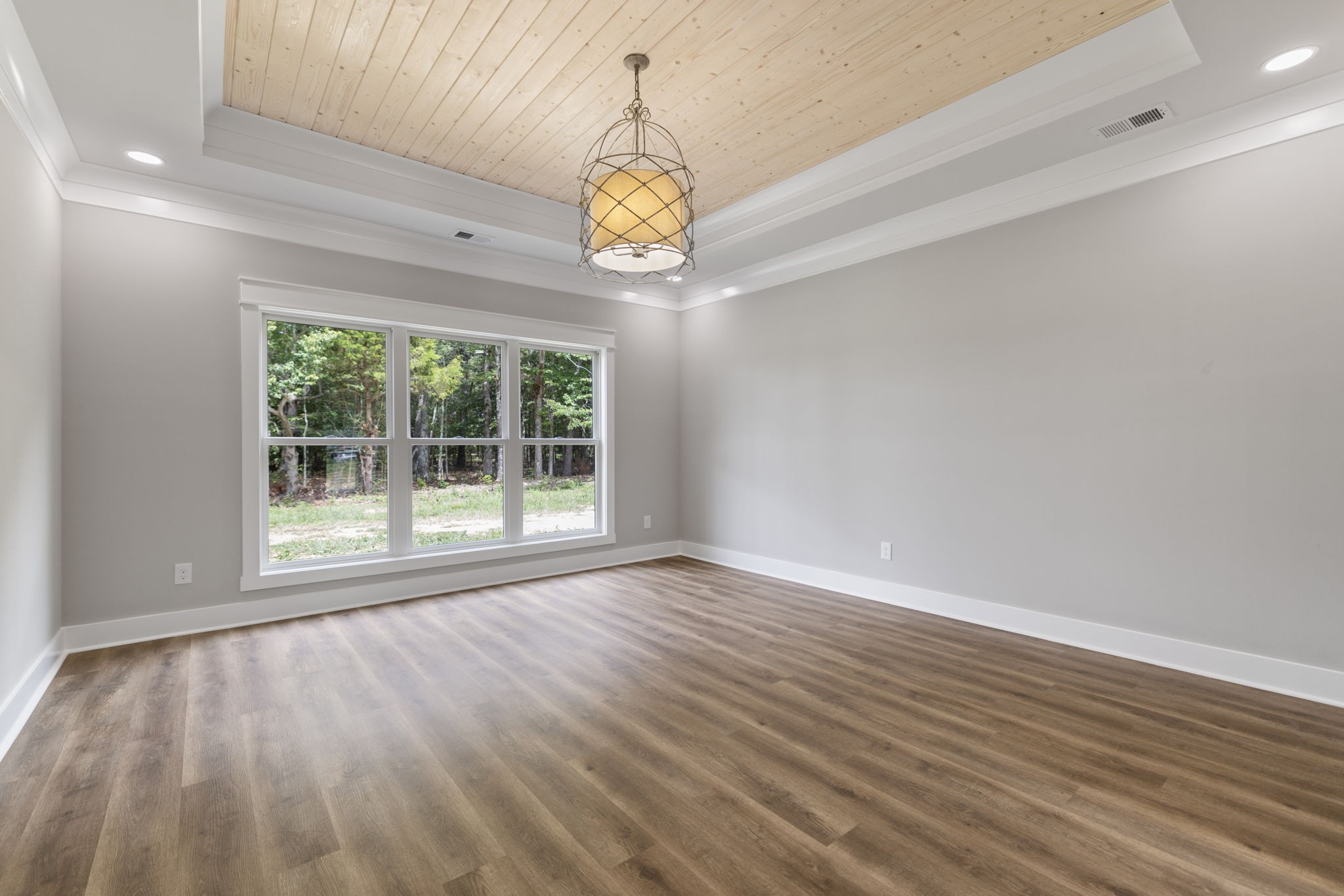 887 Ovoca Lake Road Tullahoma, TN 37388 - Photo 29 of 58 a view of an empty room with wooden floor and a window