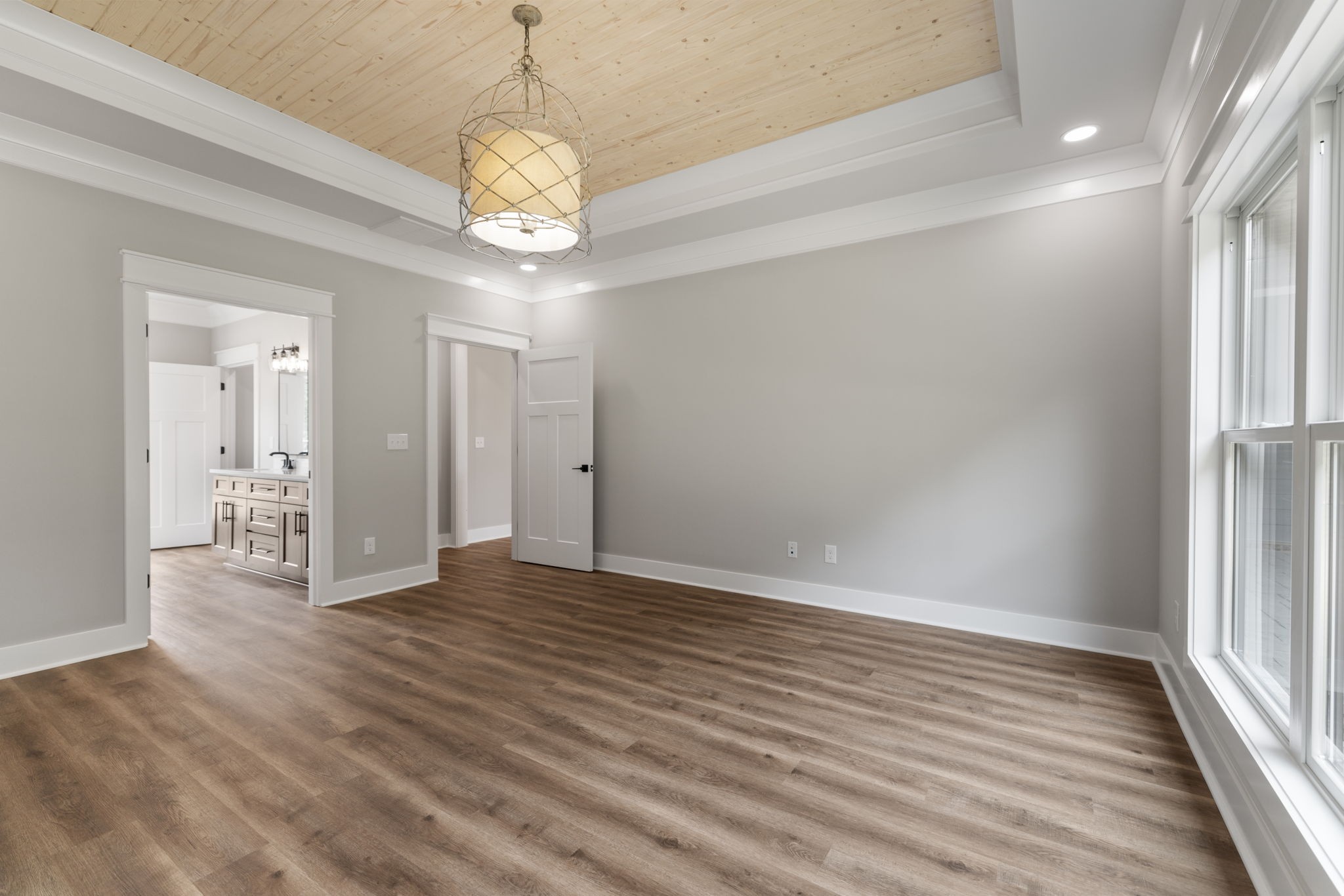 887 Ovoca Lake Road Tullahoma, TN 37388 - Photo 32 of 58 a view of an empty room with wooden floor and a window