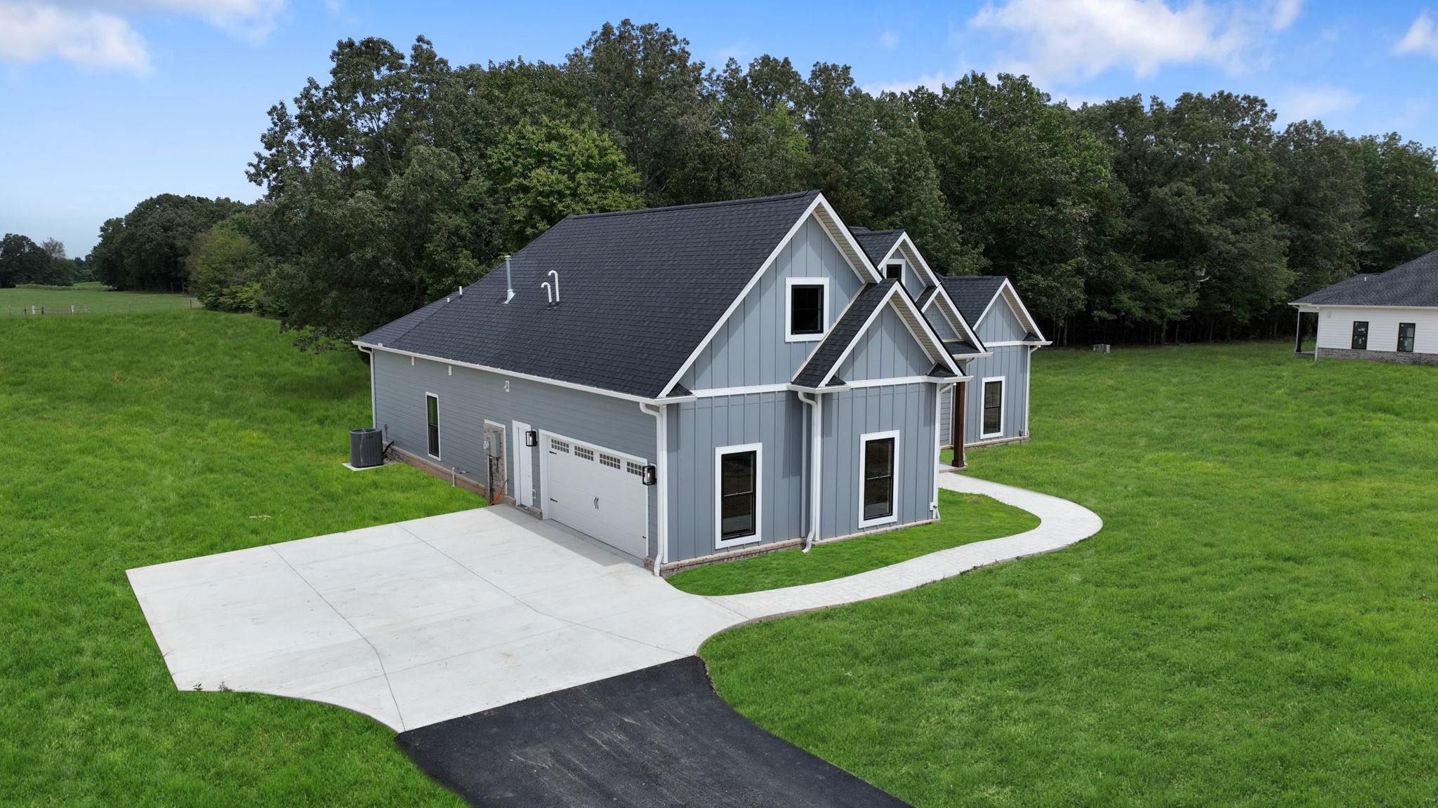 887 Ovoca Lake Road Tullahoma, TN 37388 - Photo 6 of 58 a aerial view of a house next to a big yard and large trees