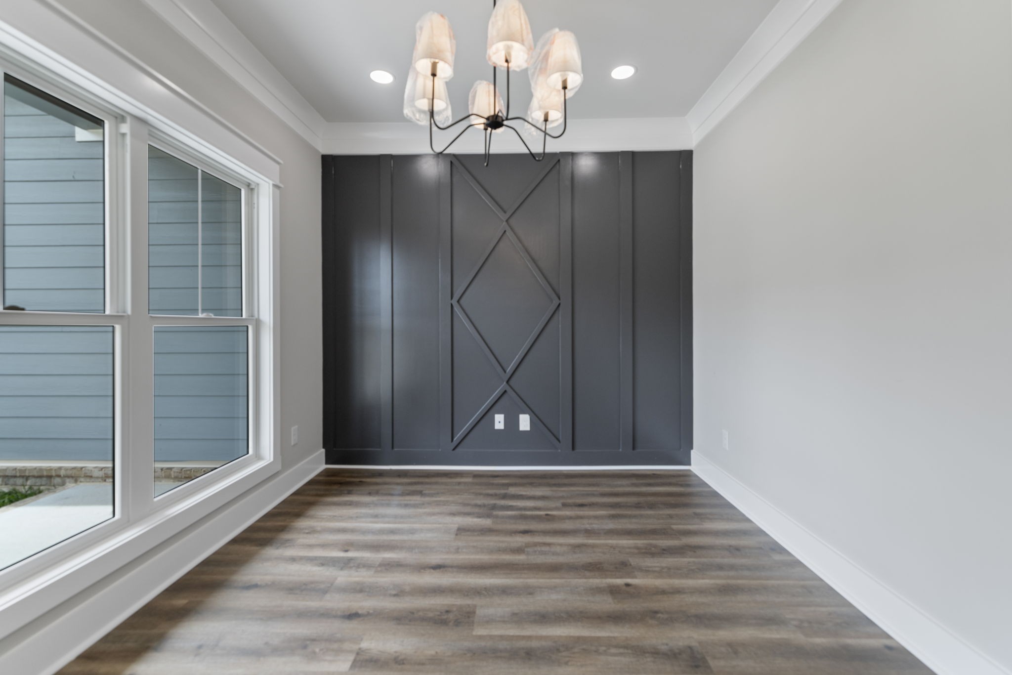 887 Ovoca Lake Road Tullahoma, TN 37388 - Photo 9 of 58 a view of an empty room with wooden floor and a window