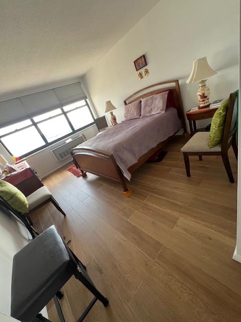 7002 Boulevard East, Unit 42D Guttenberg, NJ 07093 - Photo 22 of 42 a bedroom with a bed and wooden floor
