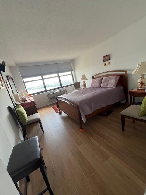 7002 Boulevard East, Unit 42D Guttenberg, NJ 07093 - Photo 24 of 42 a bedroom with bed couch and window