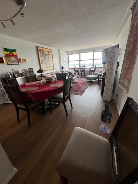 7002 Boulevard East, Unit 42D Guttenberg, NJ 07093 - Photo 26 of 42 a living room with furniture a rug and a floor to ceiling window