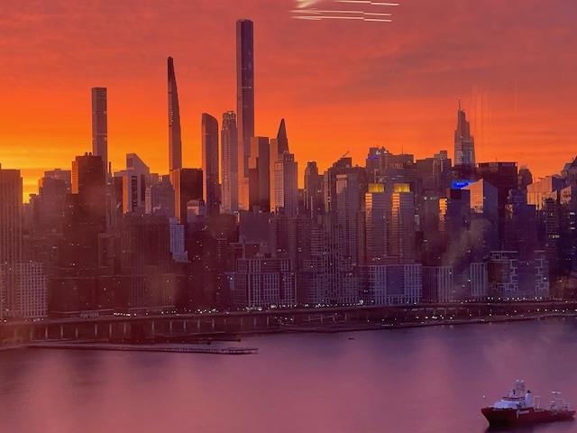 7002 Boulevard East, Unit 42D Guttenberg, NJ 07093 - Photo 28 of 42 a view of a water with a building in the background