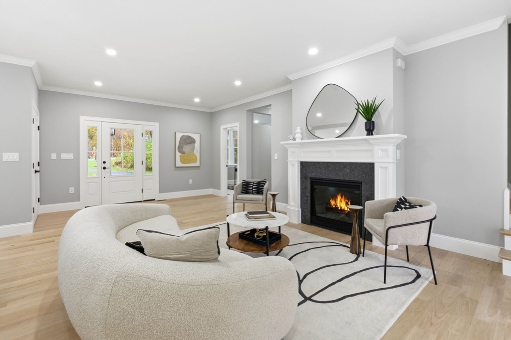 4 Chatham Lane Danvers, MA 01923 - Photo 6 of 40 a living room with furniture and a fireplace