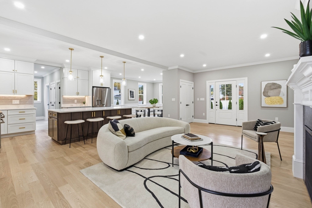 4 Chatham Lane Danvers, MA 01923 - Photo 7 of 40 a living room with furniture and a dining table with wooden floor