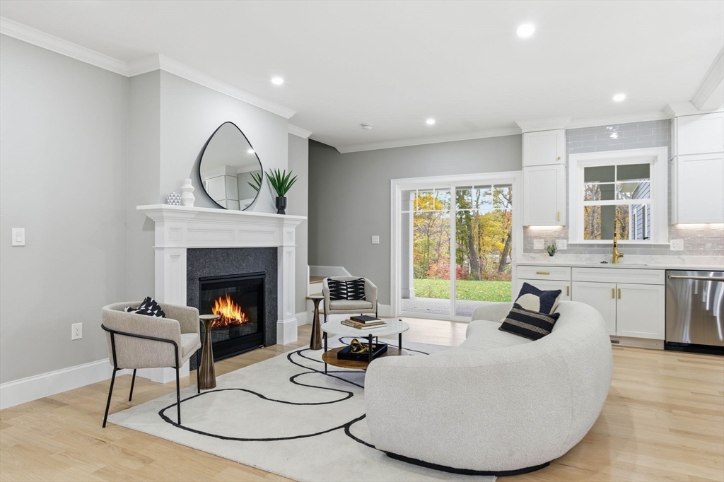 4 Chatham Lane Danvers, MA 01923 - Photo 8 of 40 a living room with furniture and a fireplace