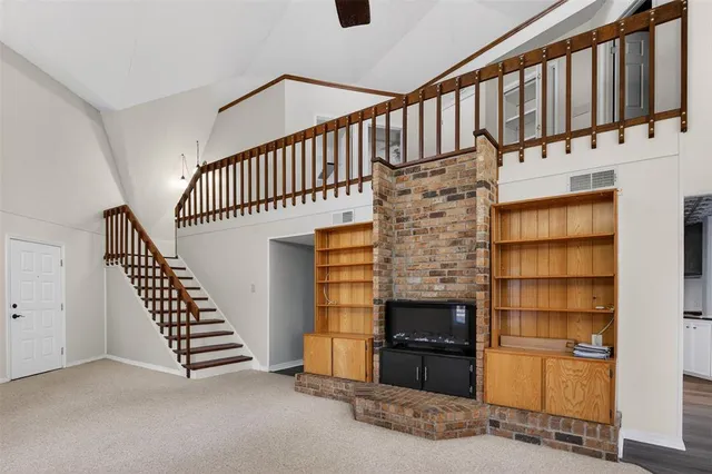 a view of staircase with wooden floor and staircase