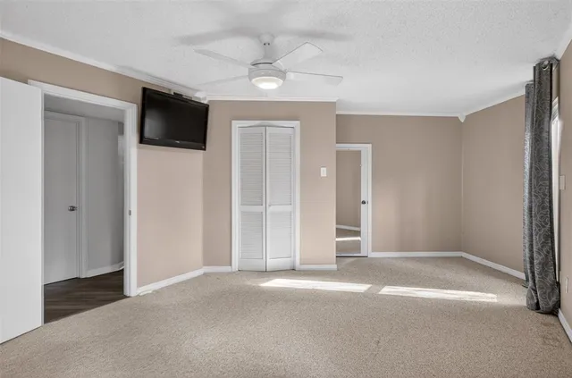a view of livingroom with an empty space and a flat screen tv