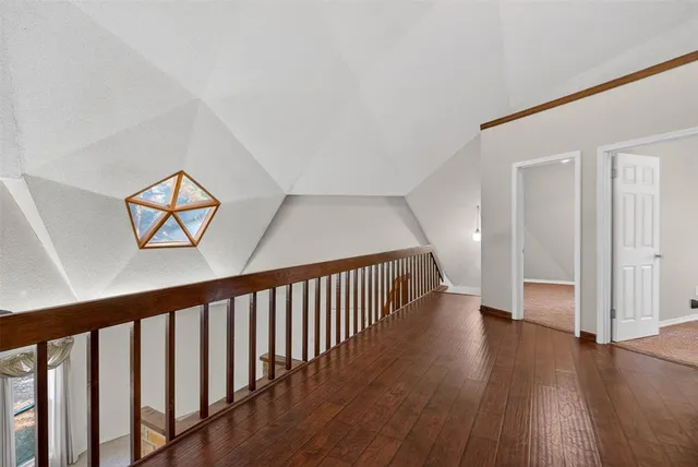 a view of gallery with wooden floor