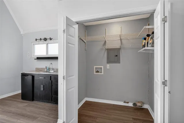a view of a hallway and a livingroom with wooden floor