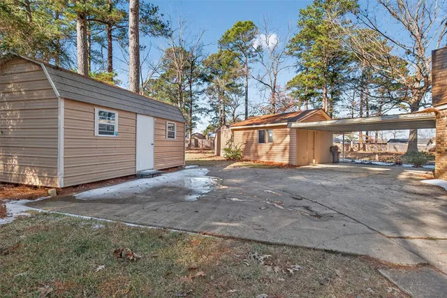 a view of a house with a yard and garage