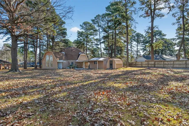 a house with trees in the background