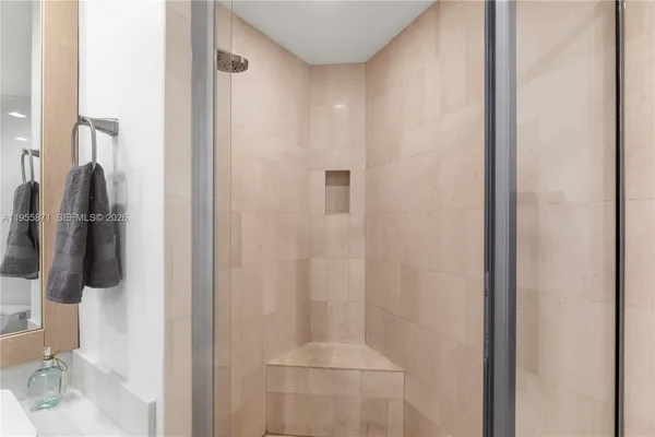 a dining room with furniture and a potted plant