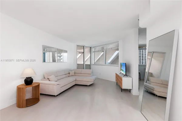 a living room with furniture and a window