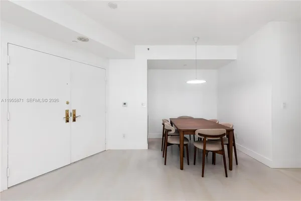 a kitchen with kitchen island a counter top space appliances and cabinets