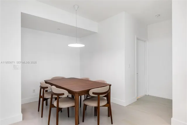 a kitchen with kitchen island a sink stainless steel appliances and cabinets