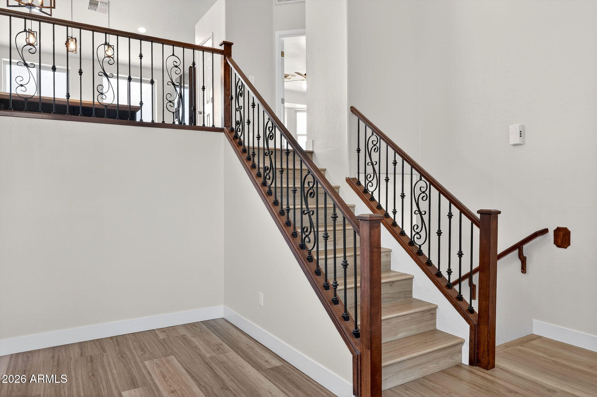 1417 East Mineral Road Gilbert, AZ 85234 - Photo 13 of 59 a view of staircase with railing and white walls