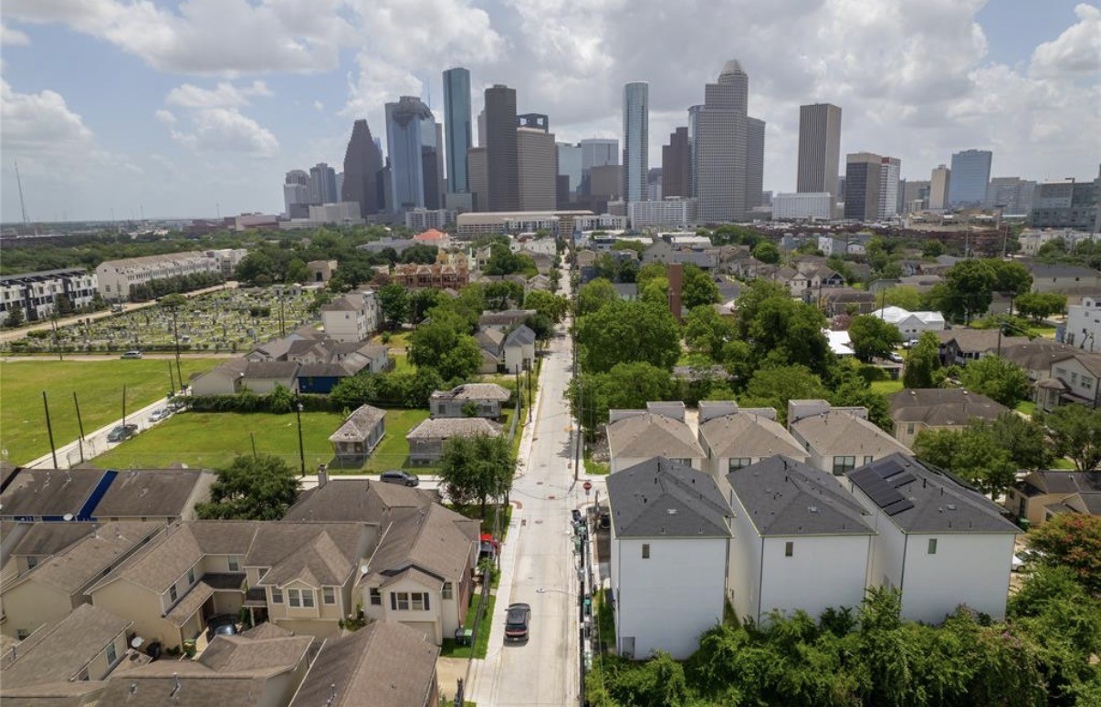 a view of a city with tall buildings