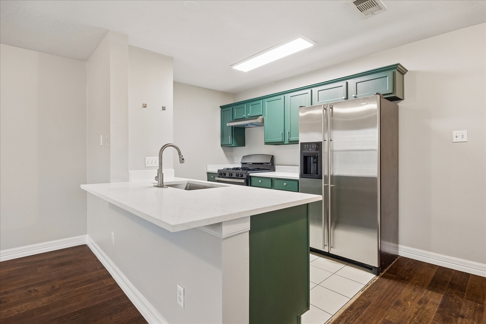 1510 Robin Street, Unit A Houston, TX 77019 - Photo 4 of 17 a kitchen with stainless steel appliances a sink and a refrigerator