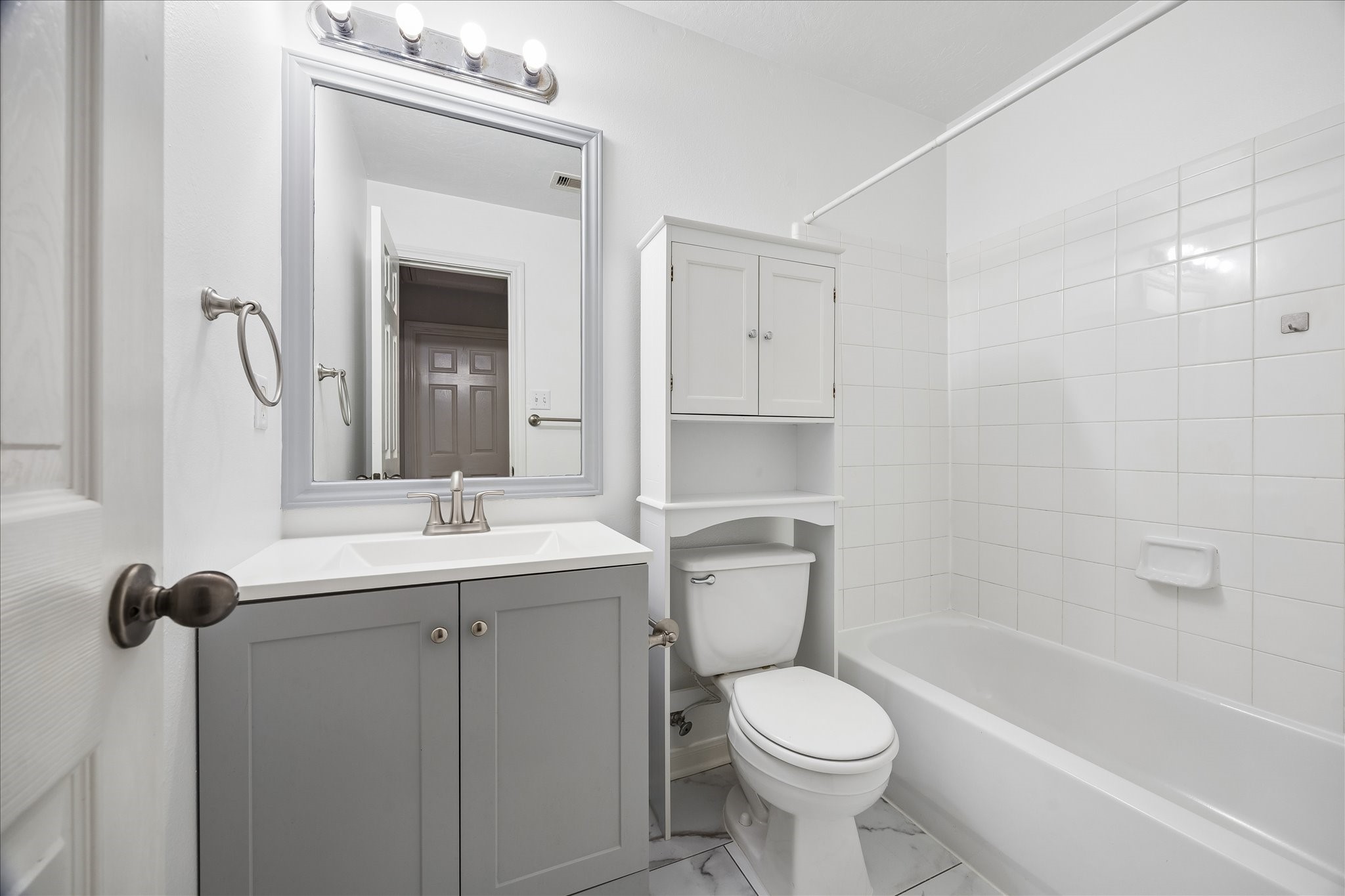 1510 Robin Street, Unit A Houston, TX 77019 - Photo 6 of 17 a bathroom with a toilet sink and mirror