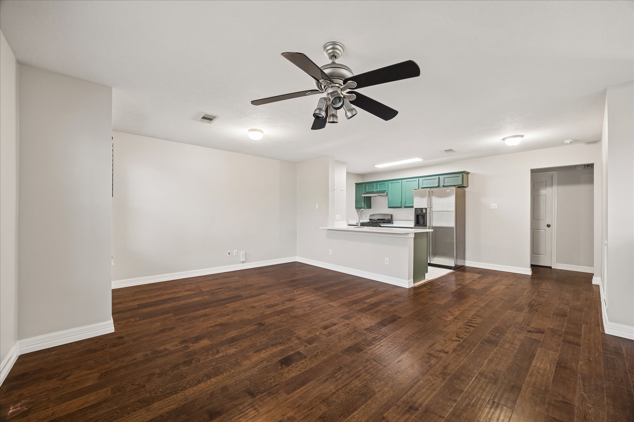 1510 Robin Street, Unit A Houston, TX 77019 - Photo 8 of 17 a view of a kitchen with a sink and dishwasher with wooden floor