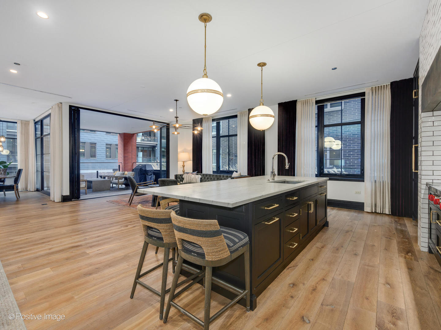 1109 West Washington Boulevard, Unit 2C Chicago, IL 60607 - Photo 15 of 40 a large kitchen with a table and chairs in it