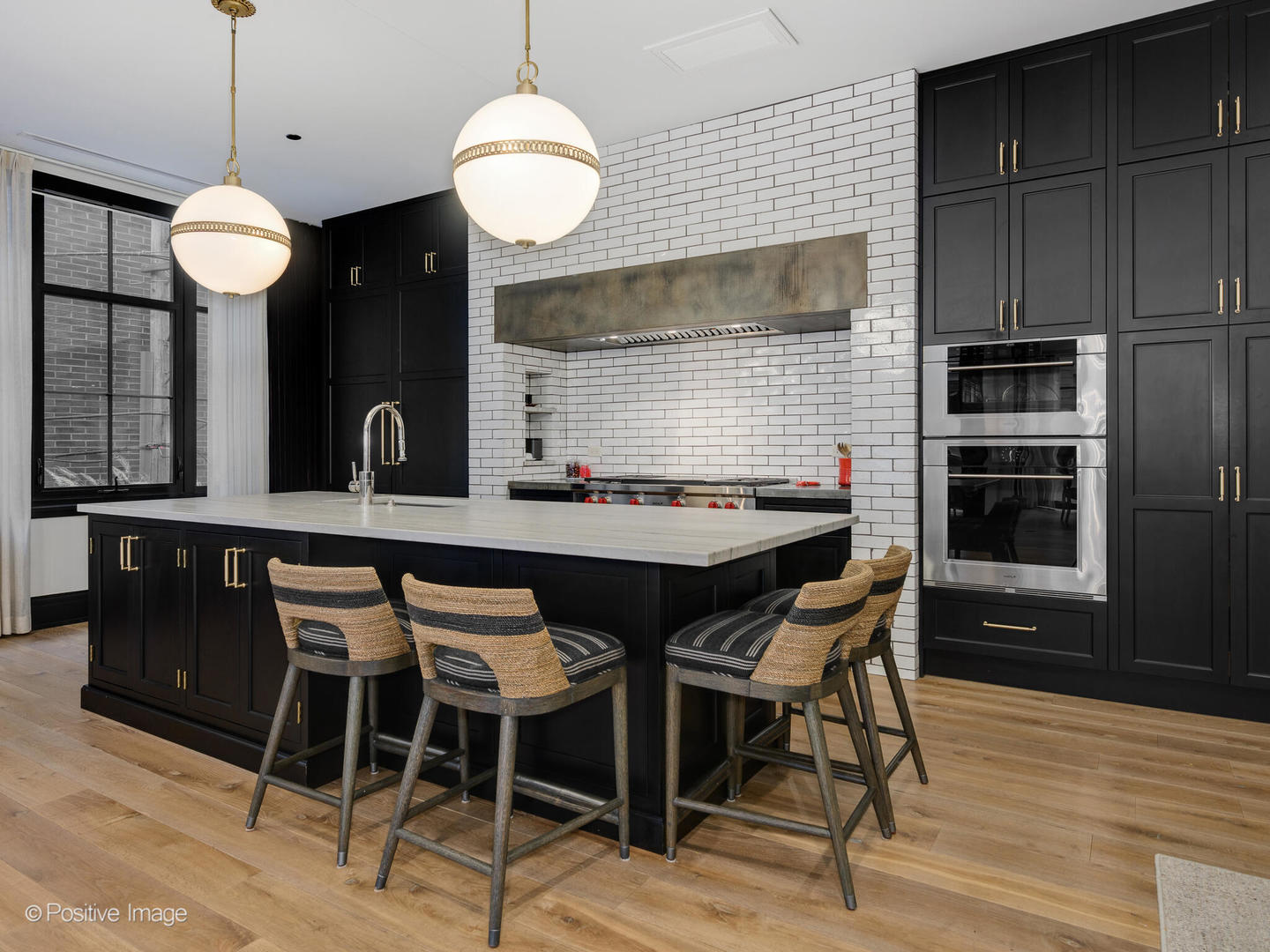 1109 West Washington Boulevard, Unit 2C Chicago, IL 60607 - Photo 17 of 40 a kitchen with a table chairs and wooden floor