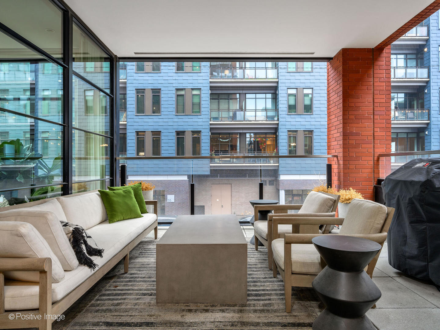1109 West Washington Boulevard, Unit 2C Chicago, IL 60607 - Photo 26 of 40 a view of a patio with couches chairs and wooden floor
