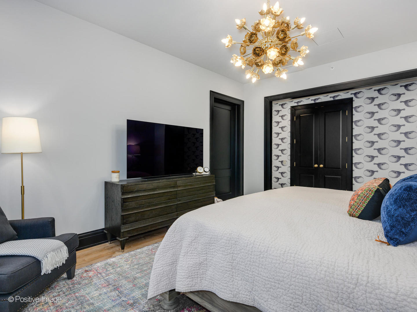 1109 West Washington Boulevard, Unit 2C Chicago, IL 60607 - Photo 29 of 40 a bedroom with a bed and a flat screen television