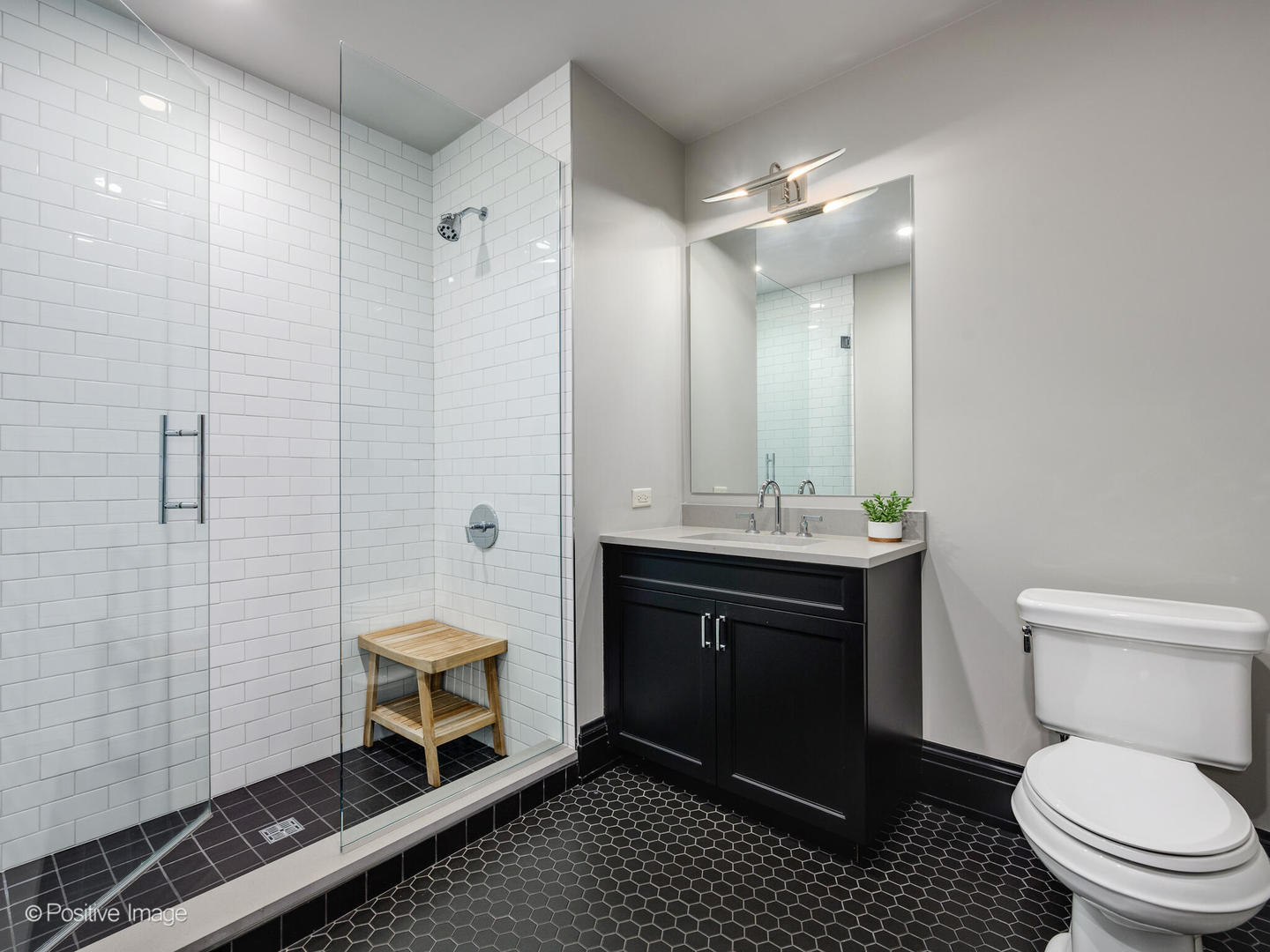 1109 West Washington Boulevard, Unit 2C Chicago, IL 60607 - Photo 37 of 40 a bathroom with a sink toilet and shower