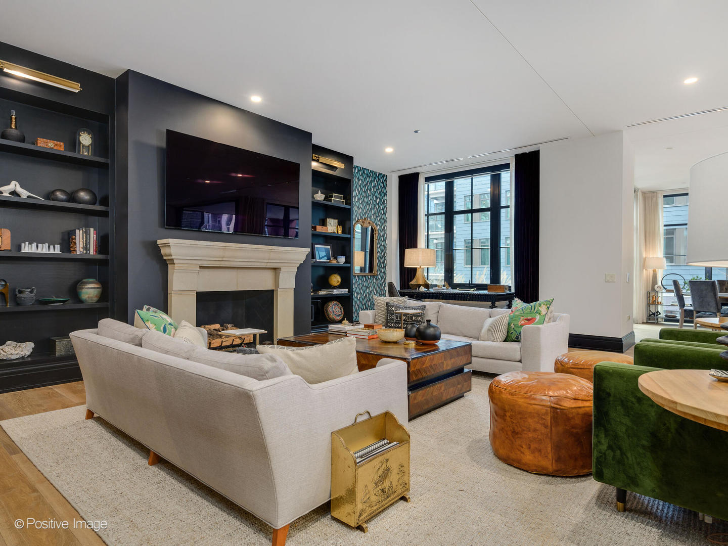 1109 West Washington Boulevard, Unit 2C Chicago, IL 60607 - Photo 10 of 40 a living room with furniture a fireplace and a flat screen tv