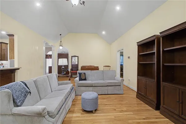 a living room with furniture and a rug