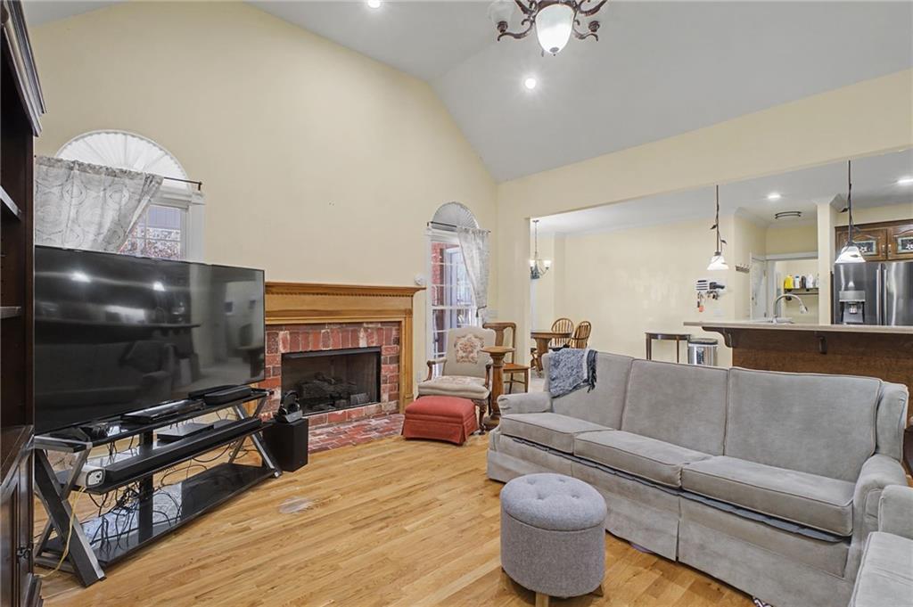15 County Road 396 Centre, AL 35960 - Photo 12 of 54 a living room with furniture a flat screen tv and a fireplace
