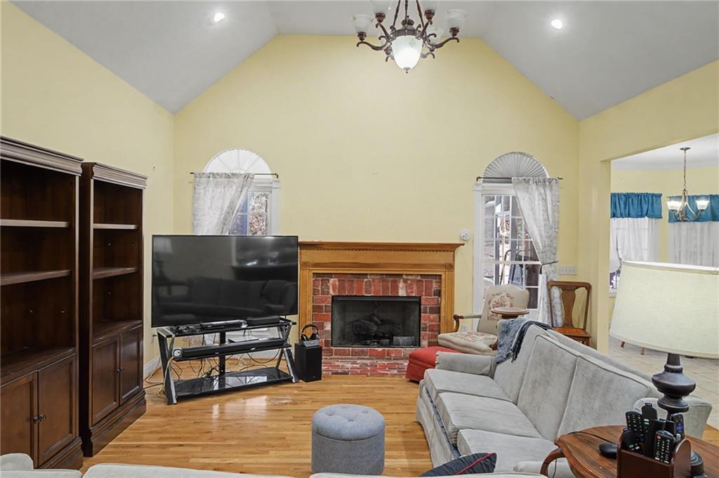 15 County Road 396 Centre, AL 35960 - Photo 14 of 54 a living room with furniture a fireplace and a flat screen tv