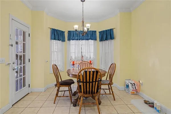 a dining room with furniture and window