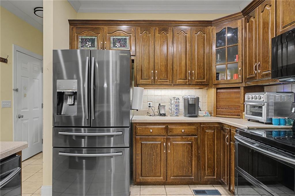 15 County Road 396 Centre, AL 35960 - Photo 24 of 54 a kitchen with stainless steel appliances granite countertop a refrigerator and a sink
