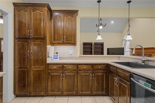 a kitchen with a sink and a refrigerator