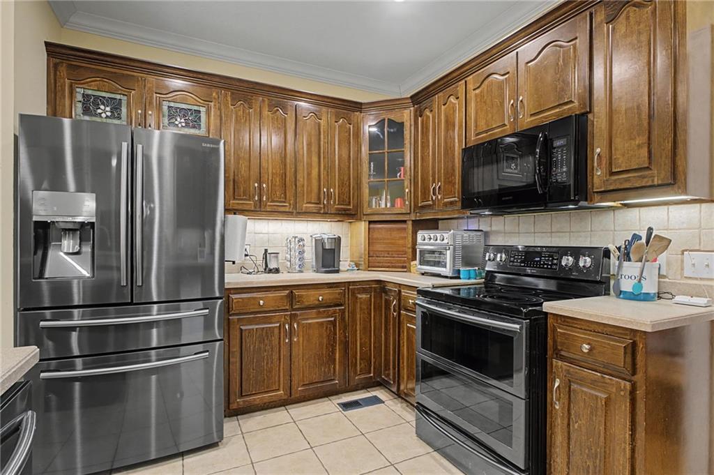15 County Road 396 Centre, AL 35960 - Photo 28 of 54 a kitchen with stainless steel appliances granite countertop a stove top oven a sink and dishwasher