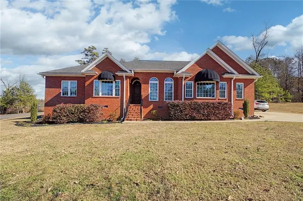 front view of a house with a yard