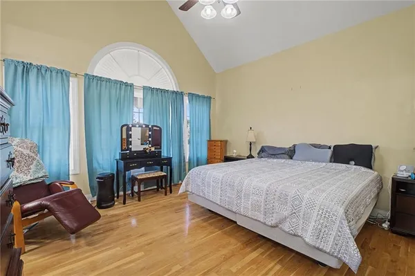 a bed room with a bed and a television