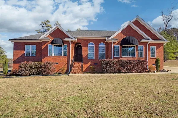 a front view of a house with a yard