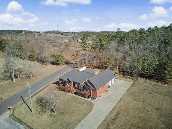 a view of a house with swimming pool and porch
