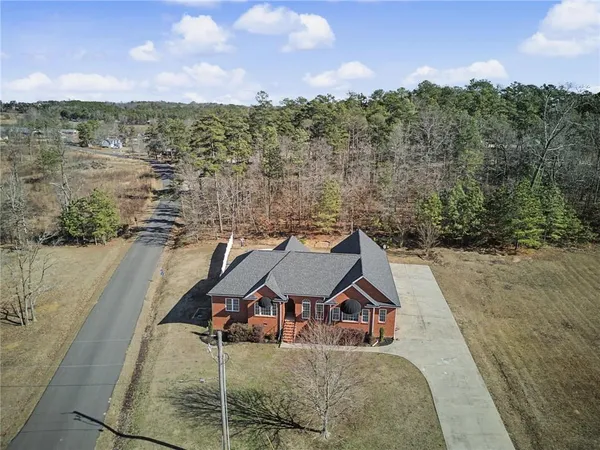 a view of a house with swimming pool and porch