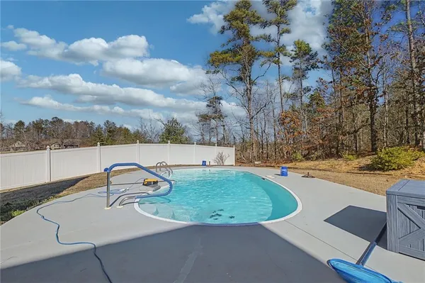 an aerial view of a house with outdoor space