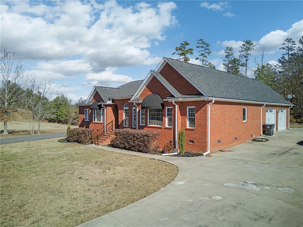 15 County Road 396 Centre, AL 35960 - Photo 9 of 54 a view of a house with a yard and garage